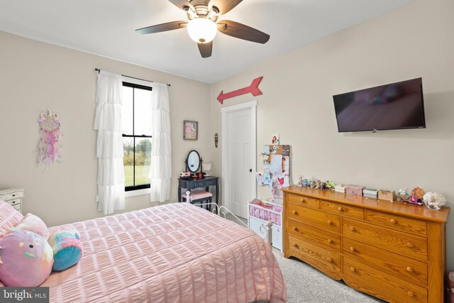 bedroom with light carpet and ceiling fan