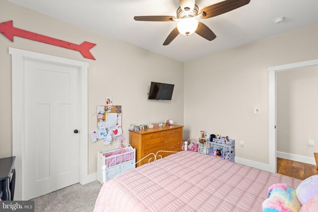 bedroom featuring ceiling fan and baseboards