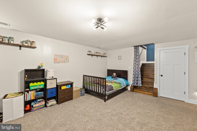 carpeted bedroom with visible vents