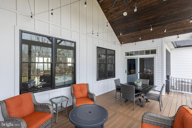 wooden deck featuring outdoor dining space