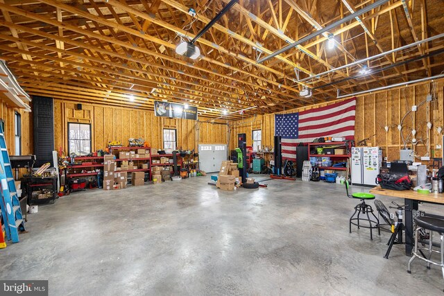 garage featuring a workshop area and a garage door opener