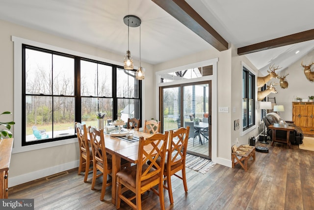 dining space with wood-type flooring, visible vents, and baseboards