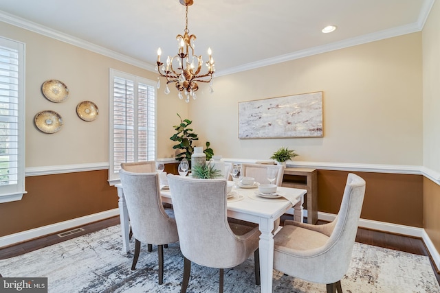 dining area featuring a healthy amount of sunlight and wood finished floors