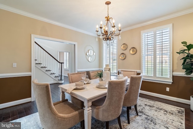 dining space with plenty of natural light, crown molding, and hardwood / wood-style floors