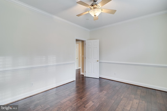 empty room with ornamental molding, wood finished floors, a ceiling fan, and baseboards