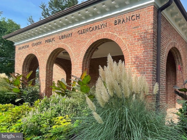 exterior space featuring brick siding