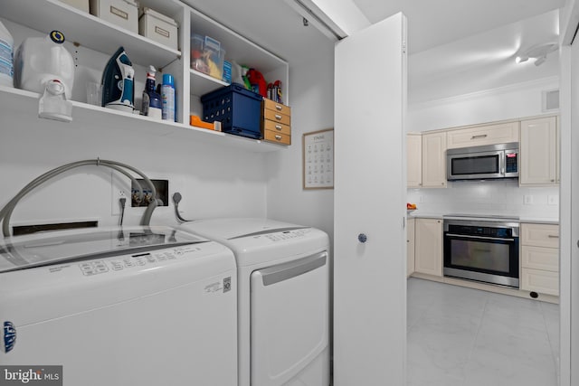 laundry room with laundry area, visible vents, washer and clothes dryer, and marble finish floor