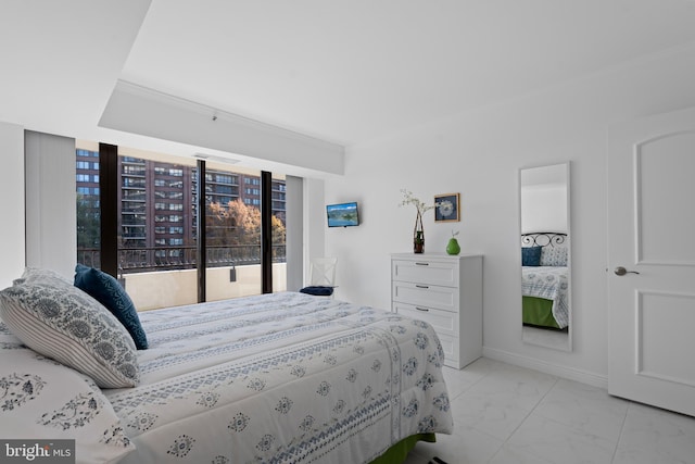 bedroom featuring crown molding, marble finish floor, and baseboards