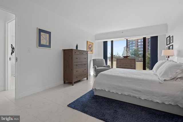 bedroom featuring access to exterior, crown molding, and baseboards