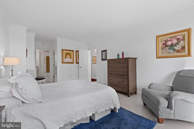 bedroom with crown molding and light tile patterned floors