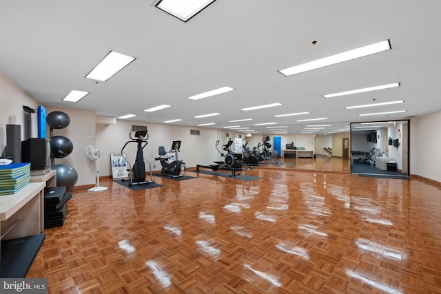 exercise room with baseboards