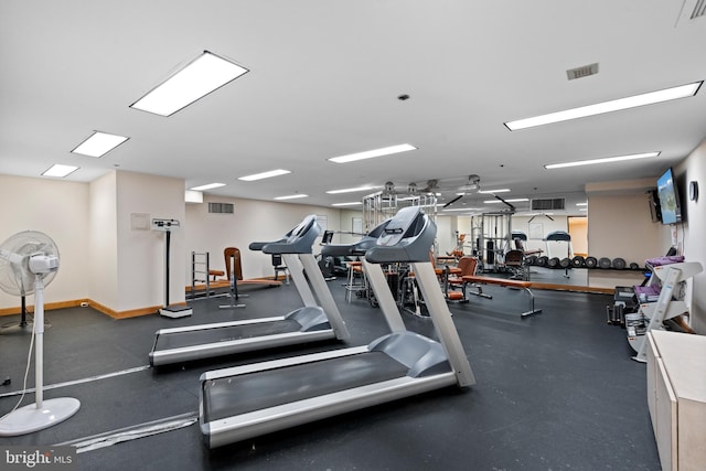 gym with baseboards and visible vents