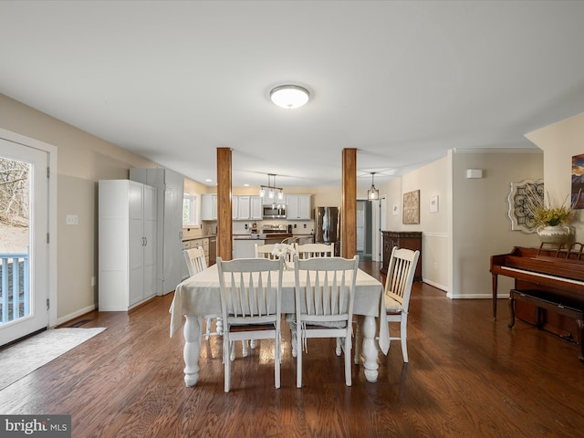 dining room with baseboards and dark wood-style flooring