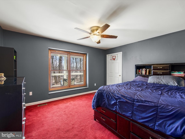 bedroom featuring carpet flooring, baseboards, visible vents, and ceiling fan