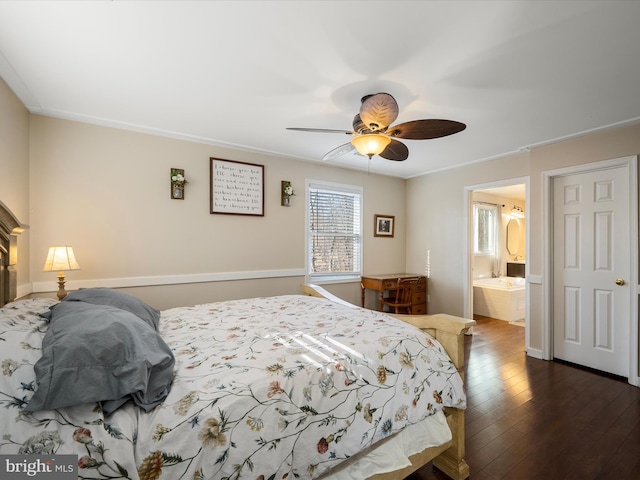 bedroom featuring connected bathroom, hardwood / wood-style floors, and a ceiling fan