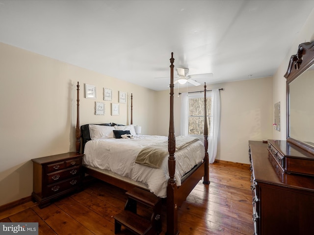 bedroom featuring baseboards, wood-type flooring, and a ceiling fan