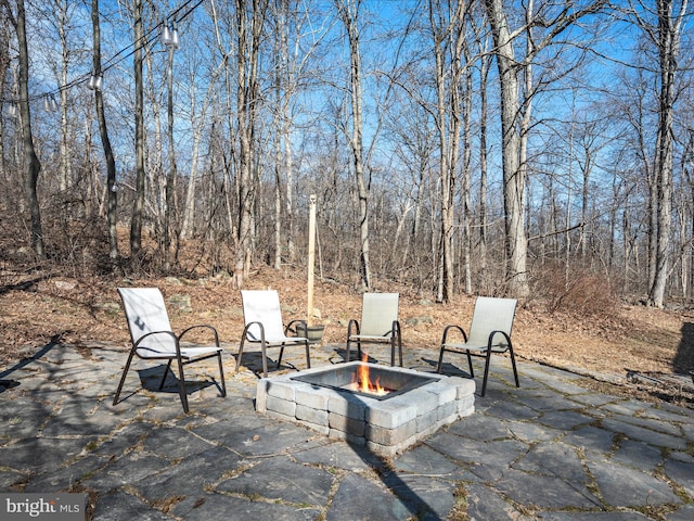 view of patio with a fire pit