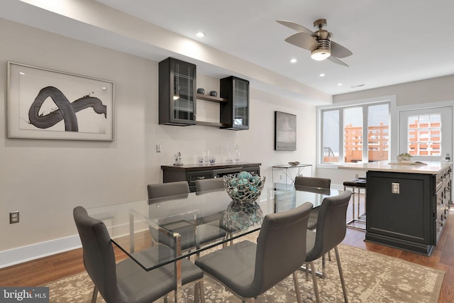 dining area with ceiling fan, baseboards, dark wood-type flooring, and recessed lighting