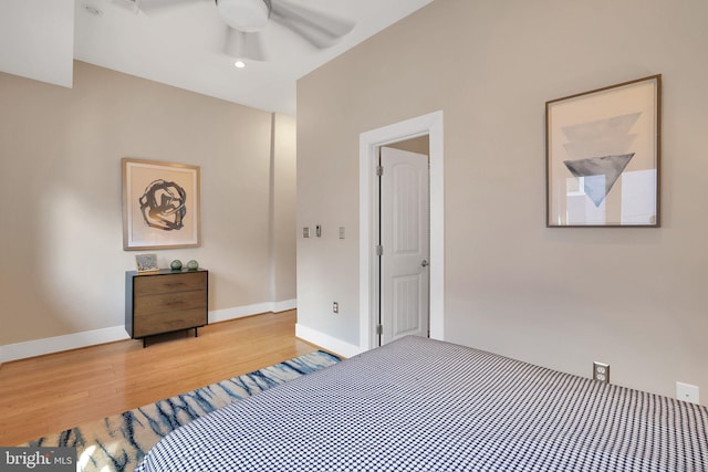 unfurnished bedroom featuring light wood-style floors, baseboards, and a ceiling fan