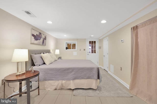 bedroom with baseboards, visible vents, and recessed lighting