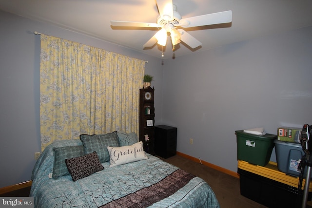 bedroom with baseboards and a ceiling fan