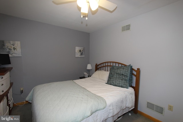 carpeted bedroom featuring ceiling fan and visible vents