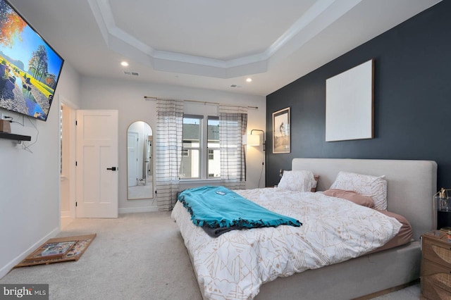 bedroom featuring recessed lighting, carpet flooring, baseboards, ornamental molding, and a tray ceiling