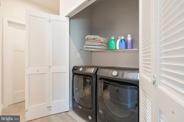 laundry room featuring washing machine and dryer and laundry area