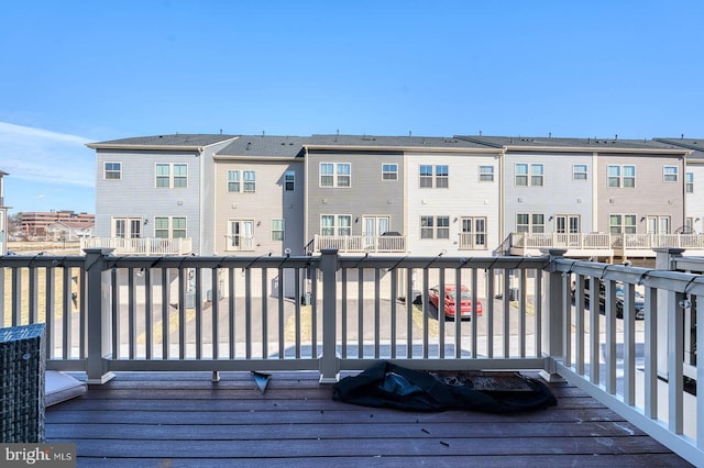 wooden terrace featuring a residential view