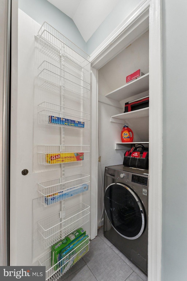 laundry area with tile patterned floors and washer / clothes dryer