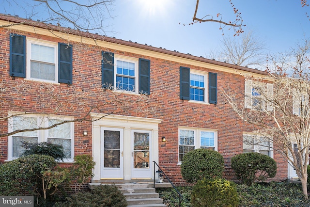 townhome / multi-family property featuring brick siding