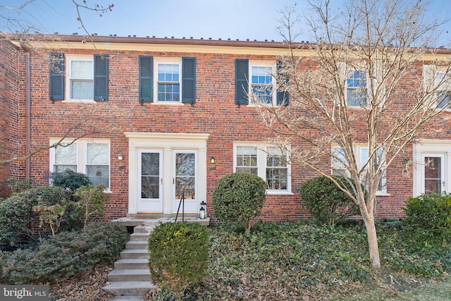 view of property featuring brick siding