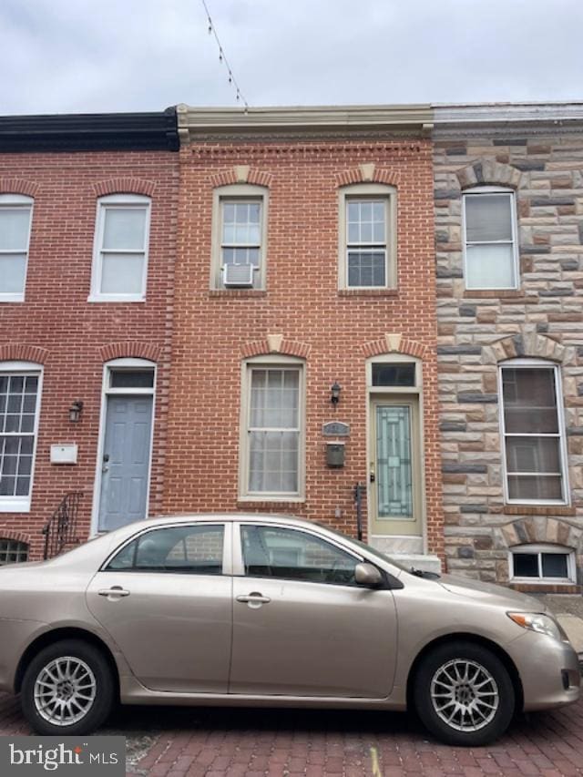 multi unit property featuring brick siding