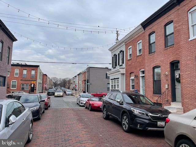 view of road with a residential view and sidewalks