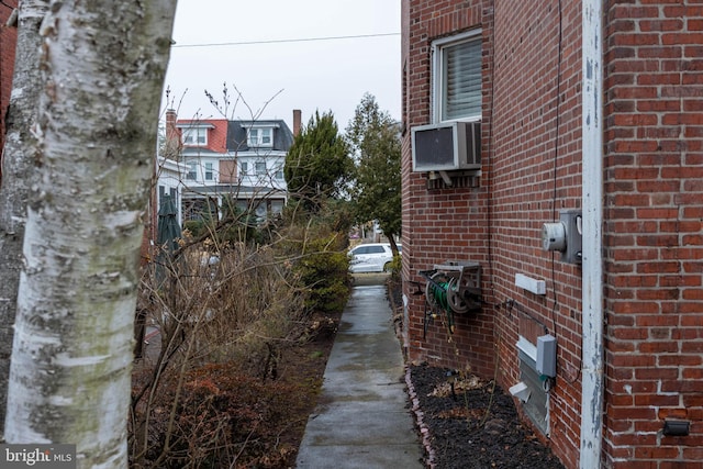 view of side of home with brick siding