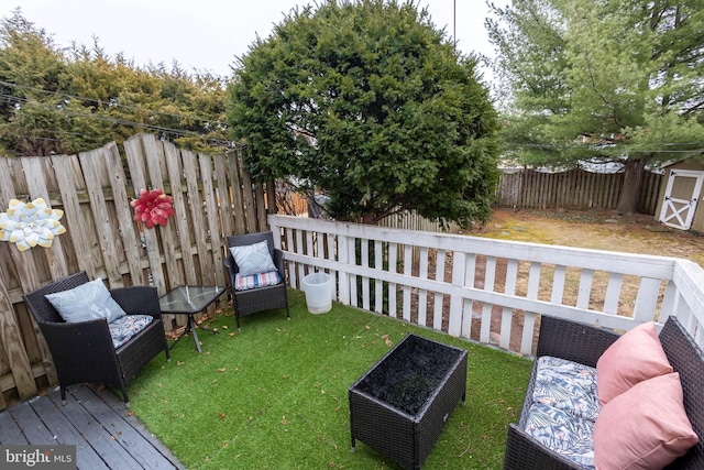 view of yard featuring a fenced backyard, a deck, and an outdoor living space