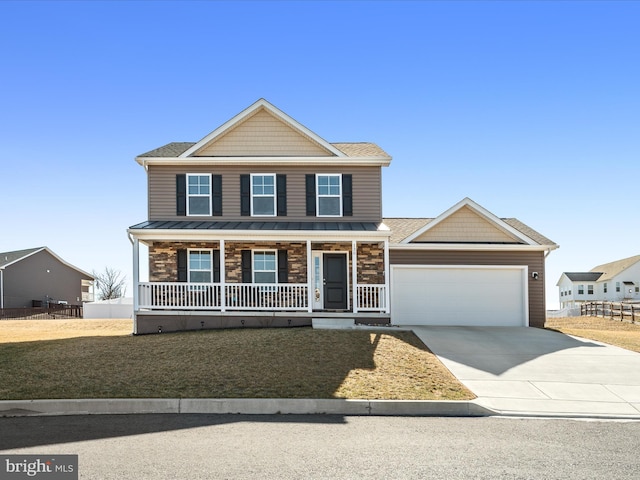 view of front of home featuring stone siding, covered porch, driveway, and an attached garage