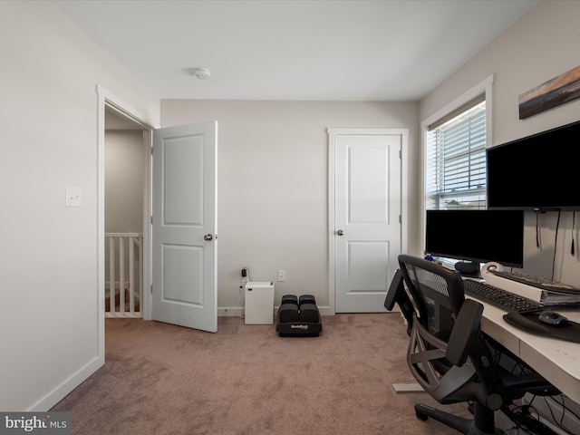 home office featuring carpet and baseboards