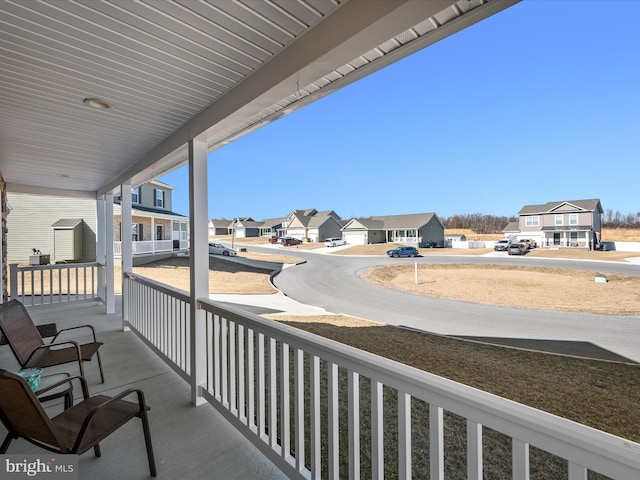 balcony featuring a porch and a residential view