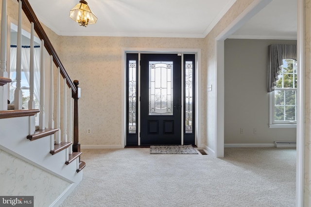 entrance foyer featuring wallpapered walls, baseboards, ornamental molding, carpet, and baseboard heating