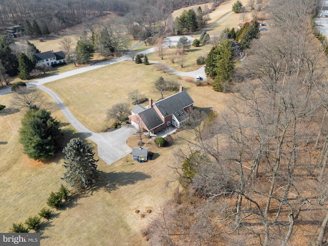 birds eye view of property with a rural view