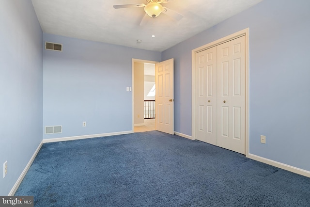 unfurnished bedroom with a ceiling fan, baseboards, visible vents, and carpet flooring