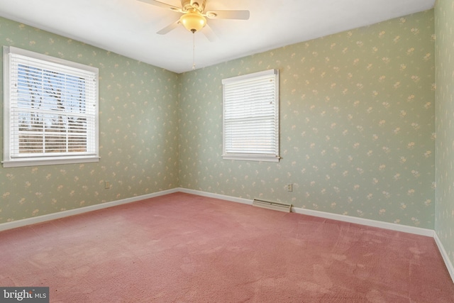 spare room with a wealth of natural light, visible vents, and carpet flooring