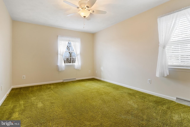 unfurnished room featuring a baseboard radiator, carpet, baseboards, and ceiling fan