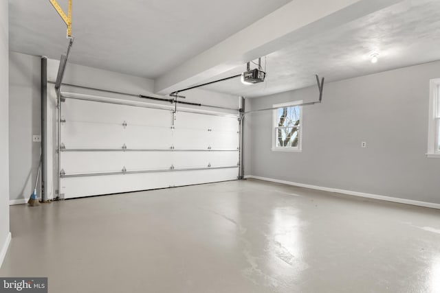 parking deck featuring baseboards and a garage door opener