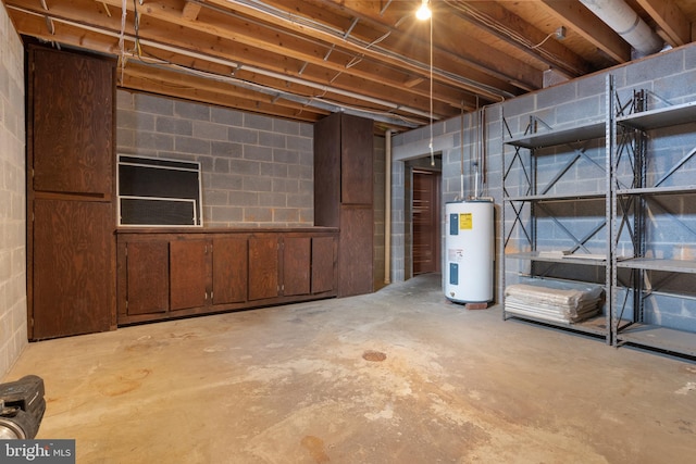 unfinished below grade area with concrete block wall and electric water heater