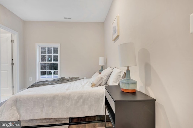 bedroom featuring visible vents