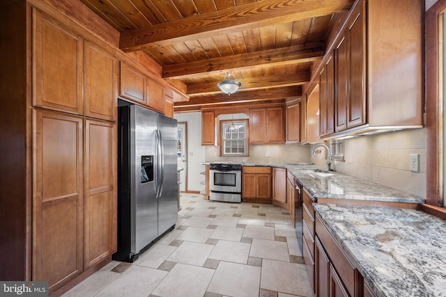 kitchen with tasteful backsplash, light stone counters, appliances with stainless steel finishes, wooden ceiling, and a sink