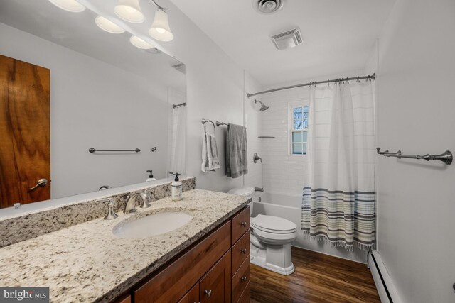 bathroom with visible vents, toilet, shower / bath combo, baseboard heating, and wood finished floors