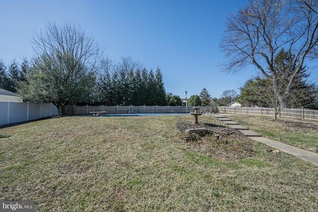 view of yard with a fenced backyard